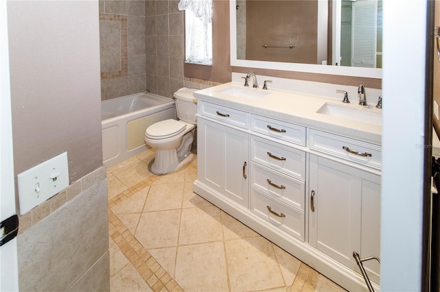 full bathroom with tiled shower / bath combo, vanity, and toilet