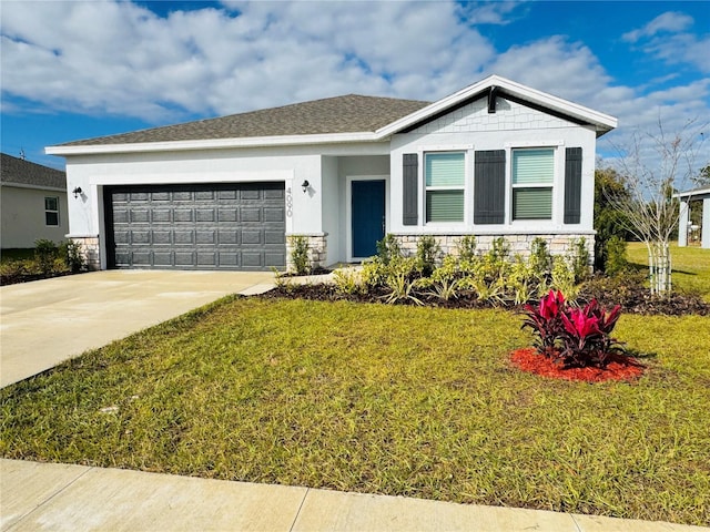 view of front of house featuring a garage and a front yard