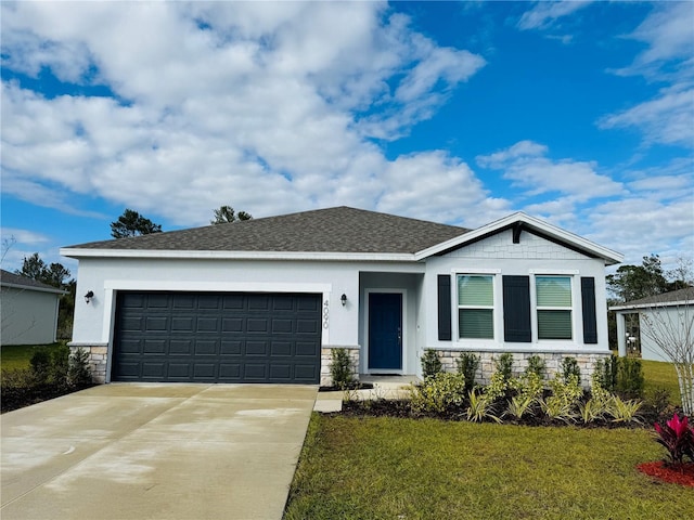 view of front facade with a garage and a front lawn