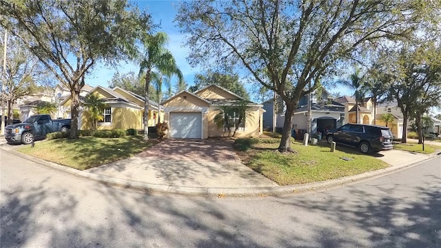 view of front facade featuring a garage and a front lawn