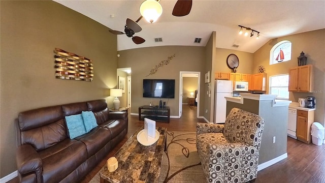 living room featuring ceiling fan, dark hardwood / wood-style flooring, and vaulted ceiling