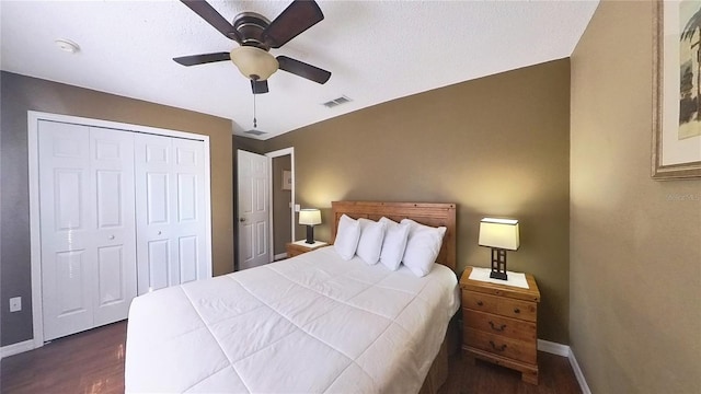 bedroom featuring dark hardwood / wood-style flooring, a closet, and ceiling fan