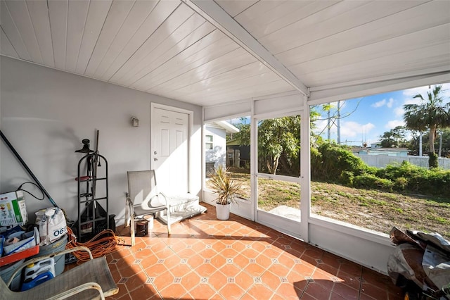 sunroom featuring plenty of natural light and wood ceiling