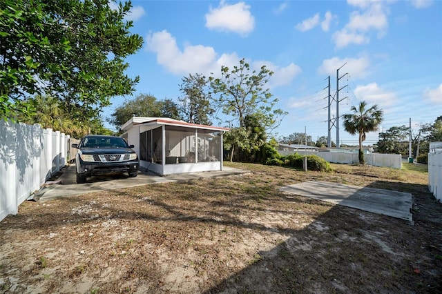 view of yard featuring a sunroom