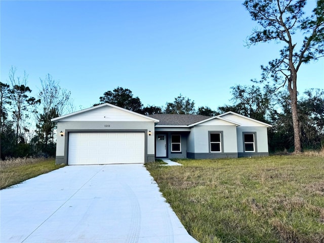 ranch-style house with a garage and a front yard