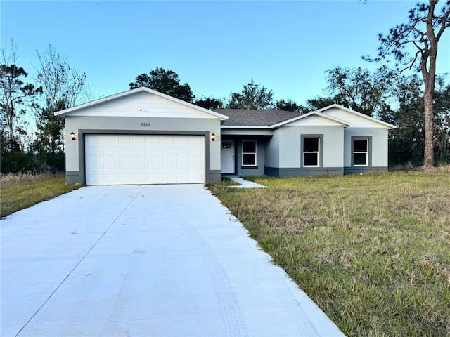 ranch-style home featuring a garage and a front lawn