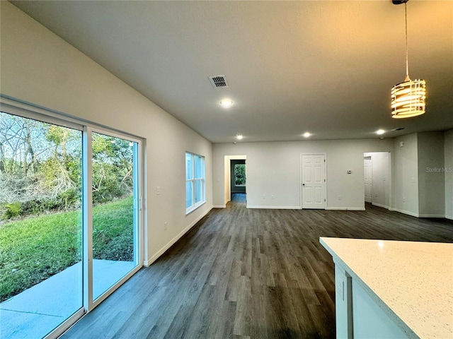 unfurnished living room featuring dark wood-type flooring