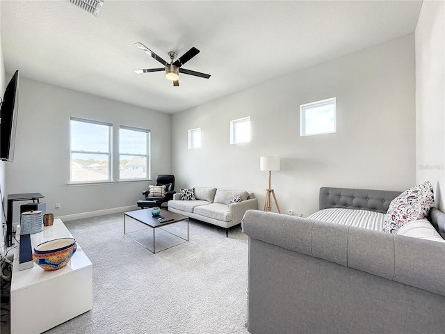 living room featuring carpet flooring and ceiling fan