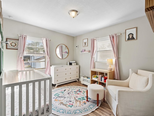 bedroom with light hardwood / wood-style flooring