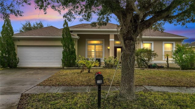 single story home featuring a garage