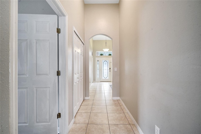 corridor with light tile patterned floors