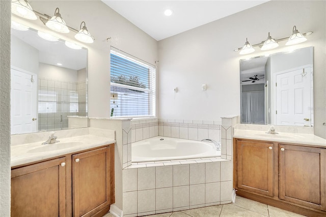 bathroom featuring tile patterned flooring, vanity, and independent shower and bath