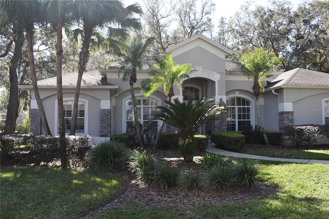 ranch-style house with a front lawn