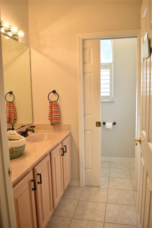 bathroom featuring tile patterned floors and vanity