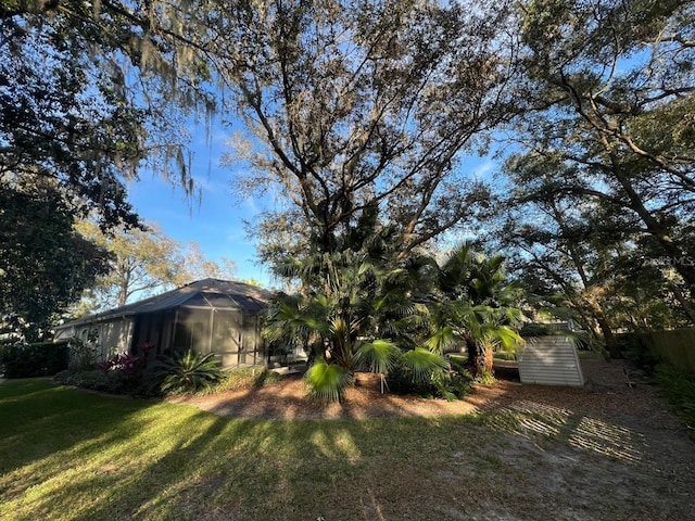 view of yard featuring glass enclosure