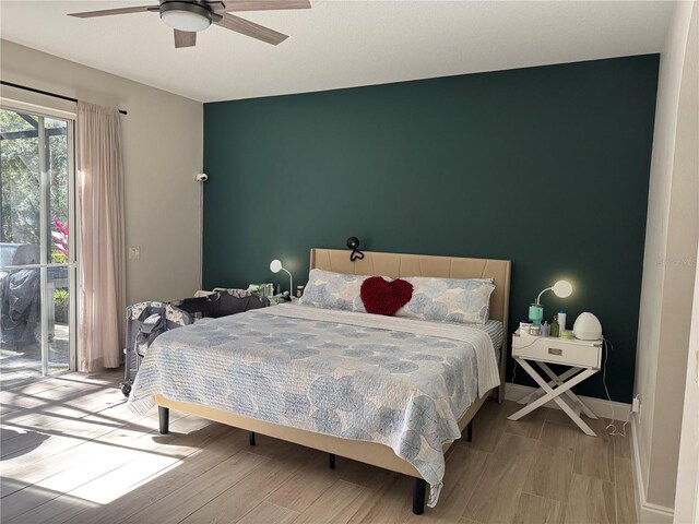 bedroom featuring ceiling fan and light wood-type flooring