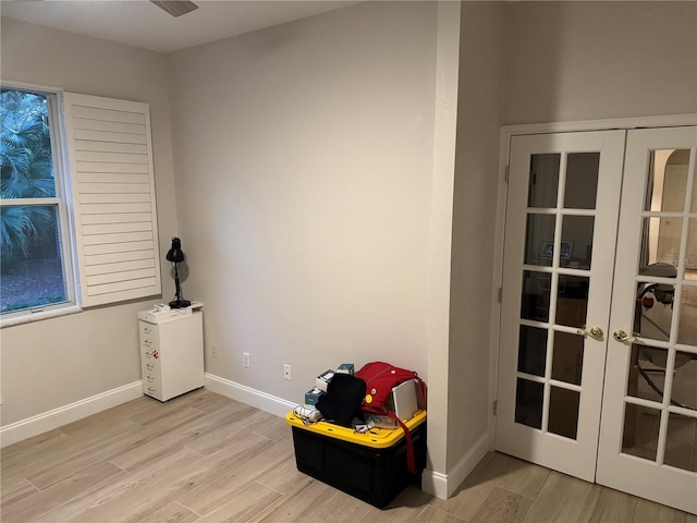 misc room with light wood-type flooring and french doors