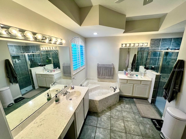 bathroom featuring tile patterned flooring, vanity, separate shower and tub, and ceiling fan