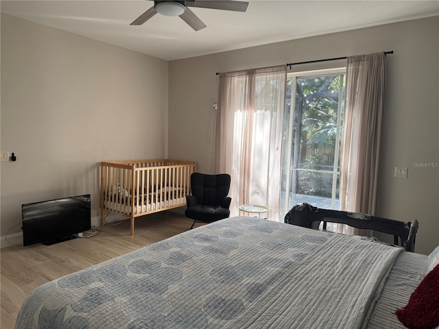 bedroom featuring wood-type flooring and ceiling fan