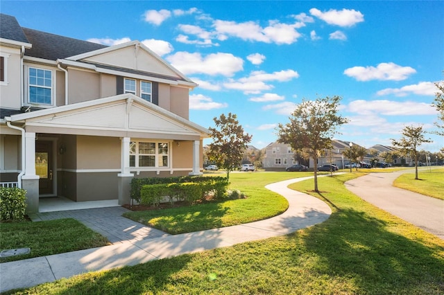 view of side of property with a lawn