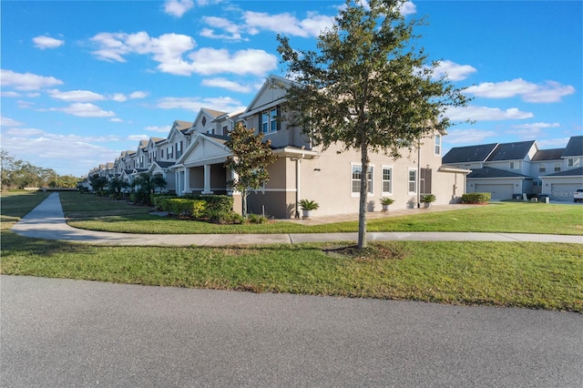 view of side of property featuring a lawn