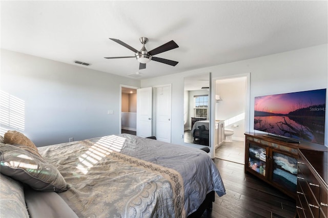 bedroom with ensuite bathroom, hardwood / wood-style floors, and ceiling fan