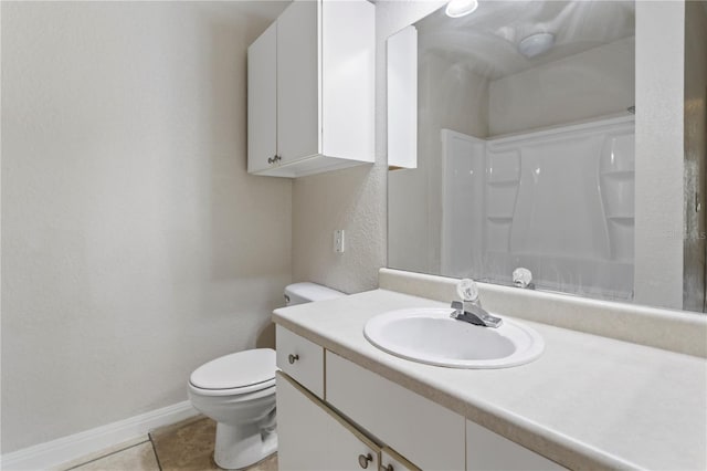 bathroom featuring vanity, toilet, tile patterned flooring, and a shower