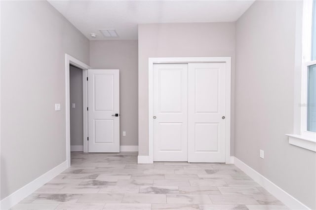 unfurnished bedroom featuring a closet