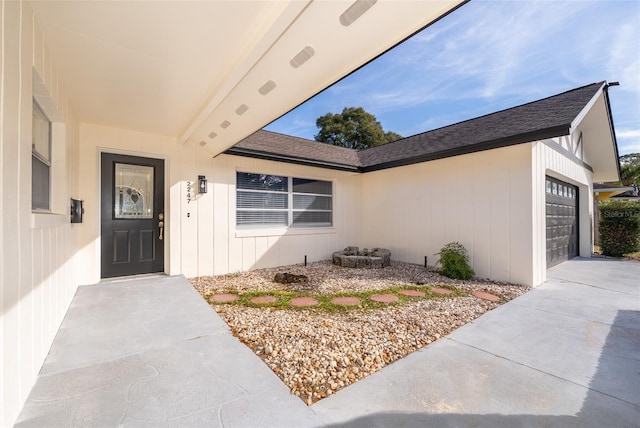 view of exterior entry with a garage