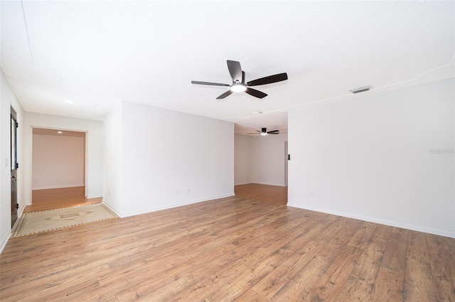 spare room featuring light hardwood / wood-style floors