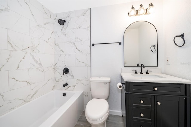 full bathroom with tiled shower / bath, vanity, and toilet