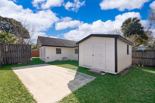 view of outbuilding featuring a yard