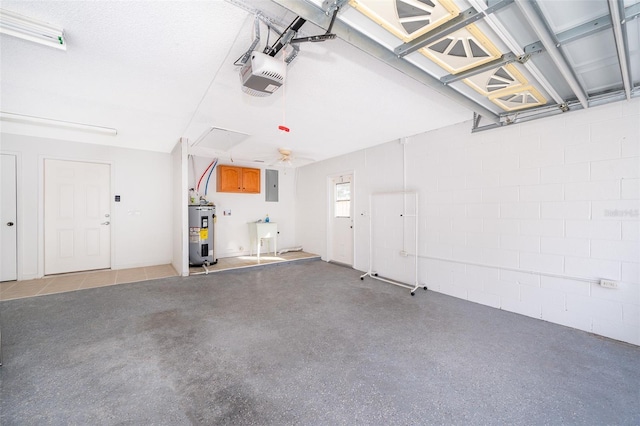 garage with sink, a garage door opener, electric panel, and water heater