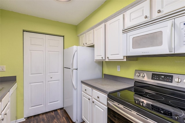 kitchen with white cabinetry, dark hardwood / wood-style floors, and white appliances