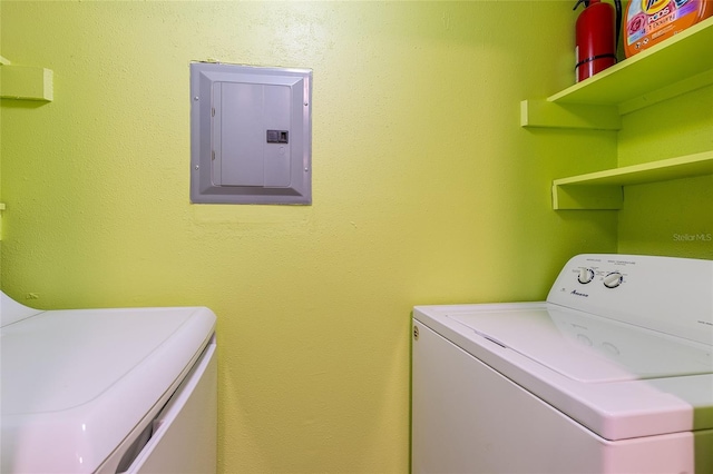 washroom with electric panel and washing machine and dryer