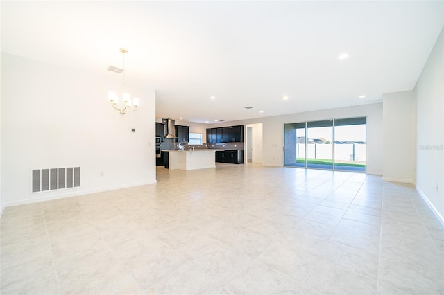 unfurnished living room with light tile patterned floors and a notable chandelier