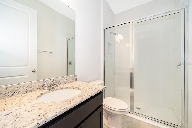 bathroom featuring vanity, an enclosed shower, tile patterned floors, and toilet