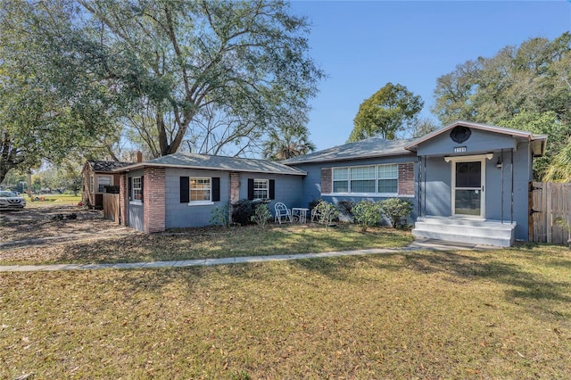 ranch-style house with a front lawn