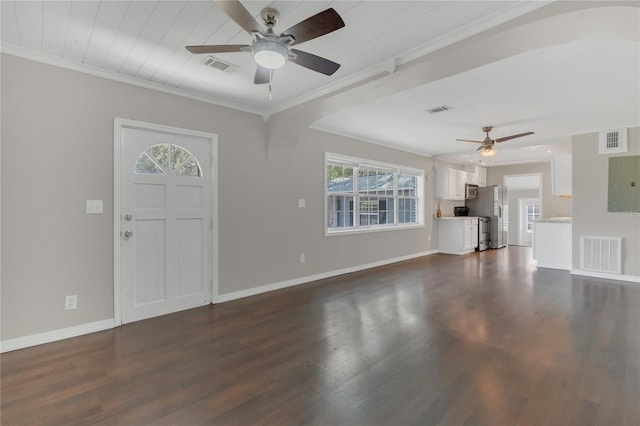 foyer entrance featuring dark hardwood / wood-style flooring, ornamental molding, and ceiling fan