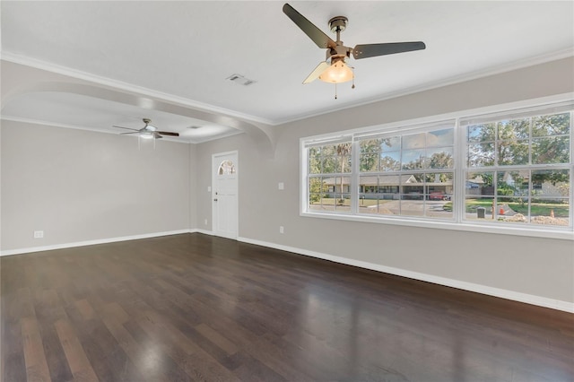 empty room with crown molding, dark wood-type flooring, and ceiling fan