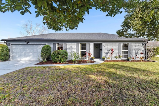 ranch-style home featuring a garage and a front lawn