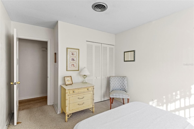 carpeted bedroom featuring a closet