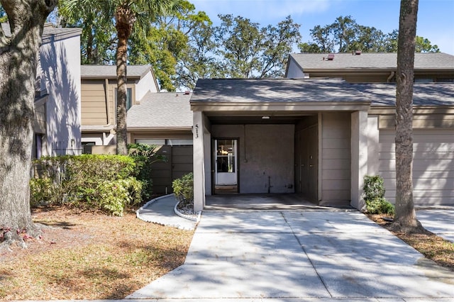 doorway to property featuring a carport