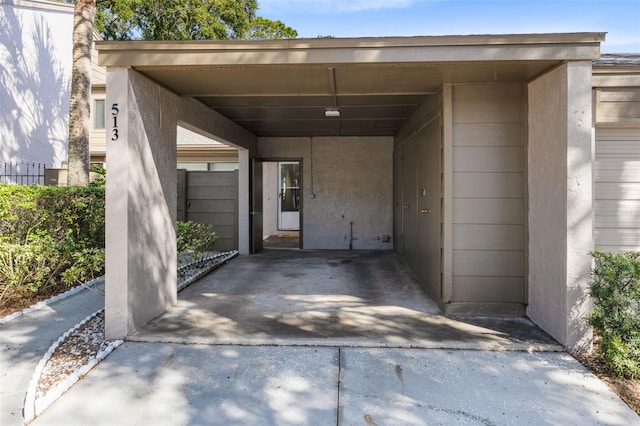 doorway to property featuring a carport