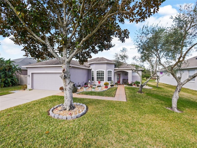 single story home with a garage and a front yard