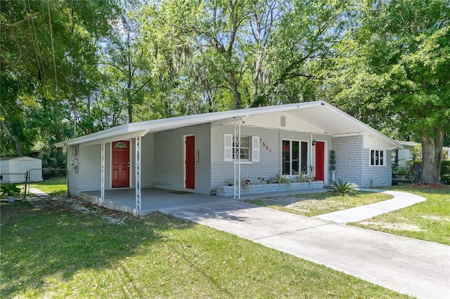 single story home featuring a carport and a front yard