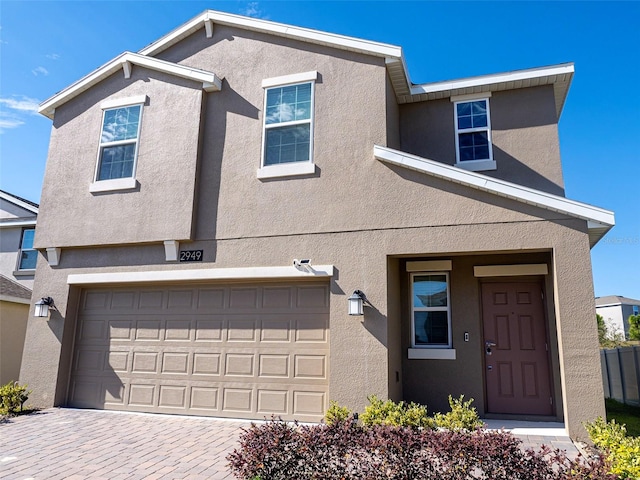 view of front of property with a garage