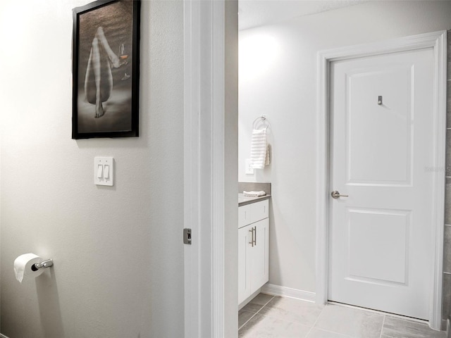 bathroom featuring vanity and tile patterned flooring