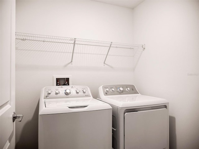 washroom featuring independent washer and dryer