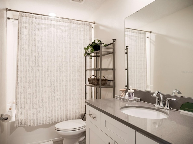 full bathroom featuring vanity, toilet, and shower / bath combo with shower curtain